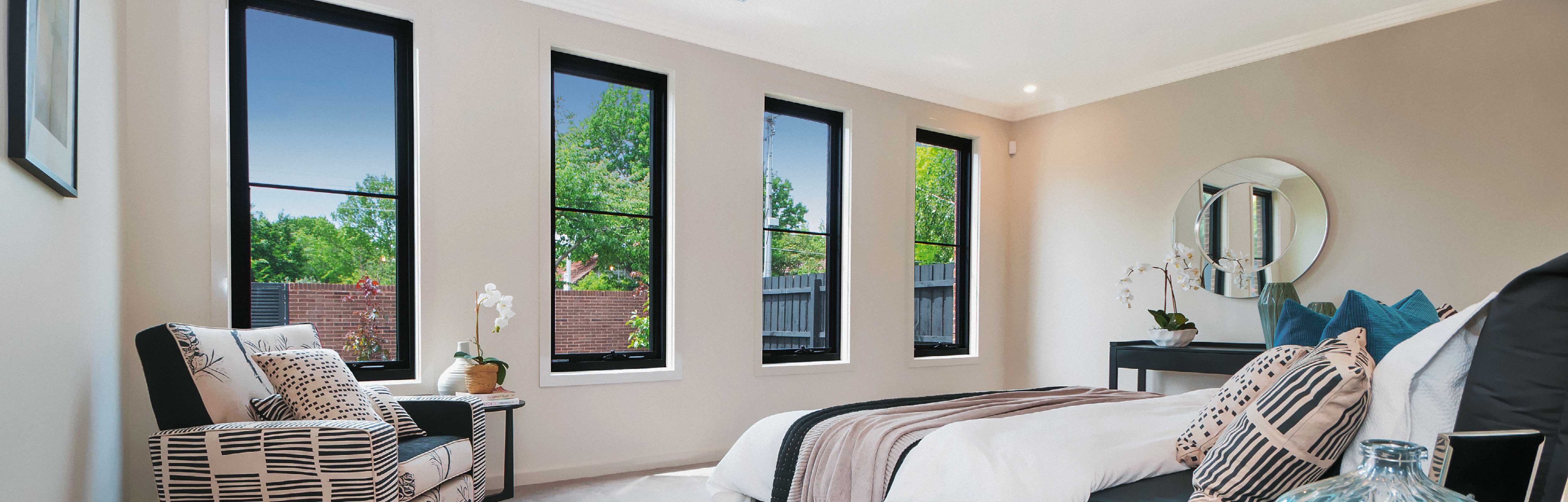 4 Black Aluminium Awning Windows in a bedroom