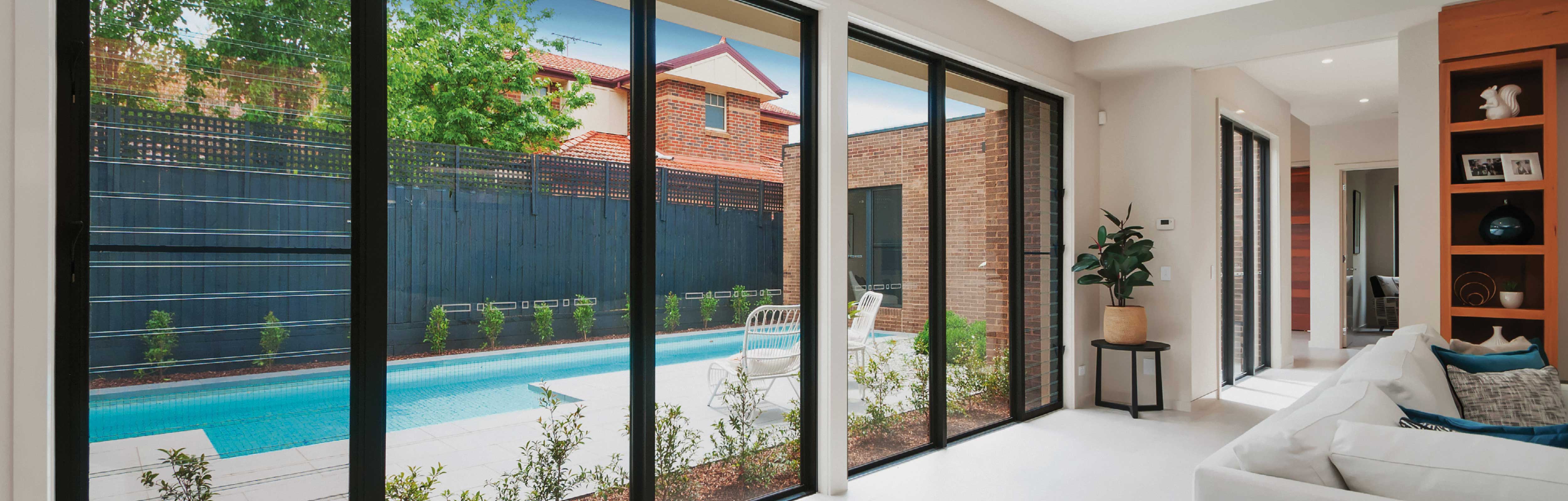 Black Frame Fixed Windows and Louvre Windows provide a view of swimming pool