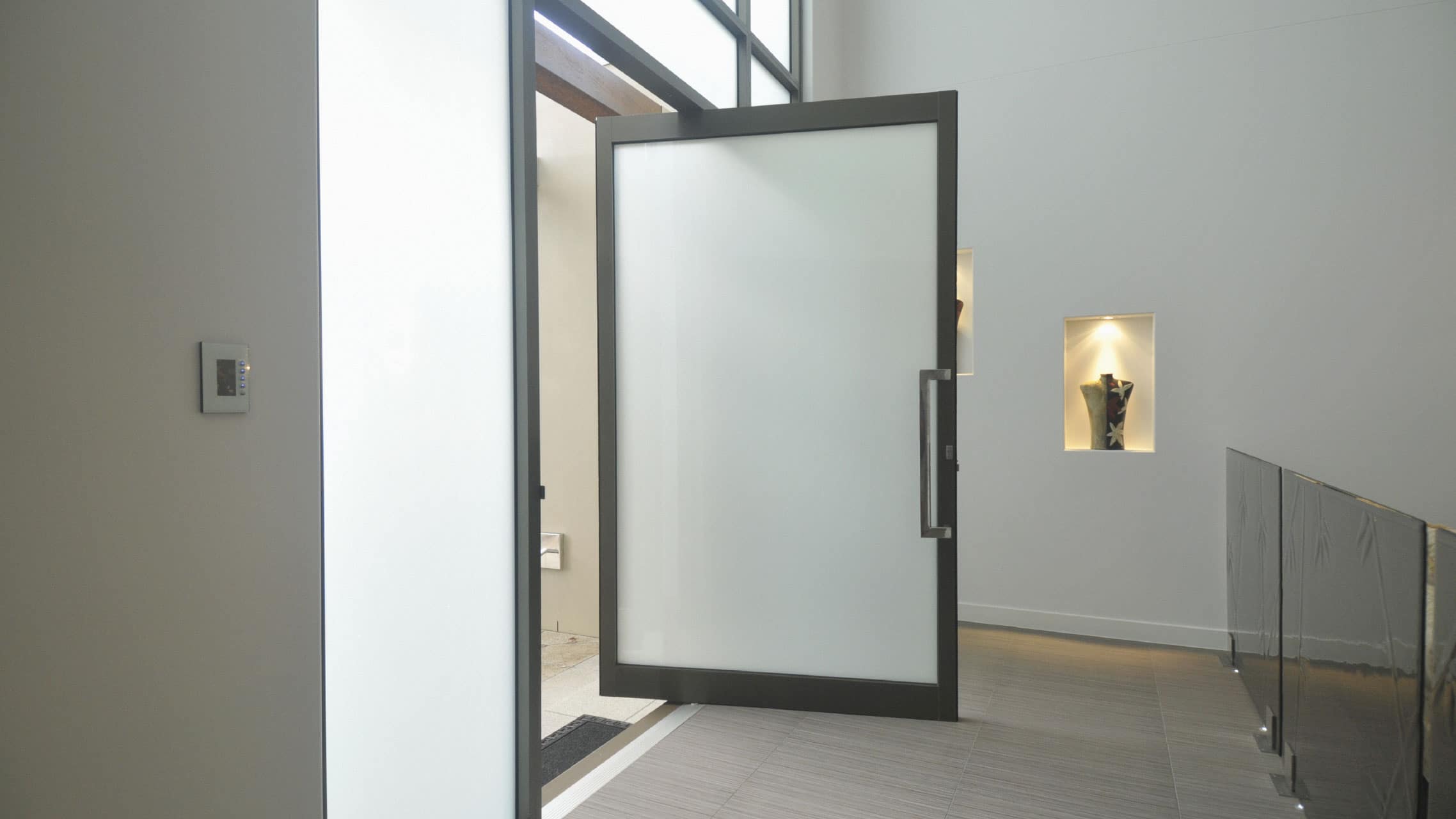 Black Aluminium Pivot Door with obscure glass