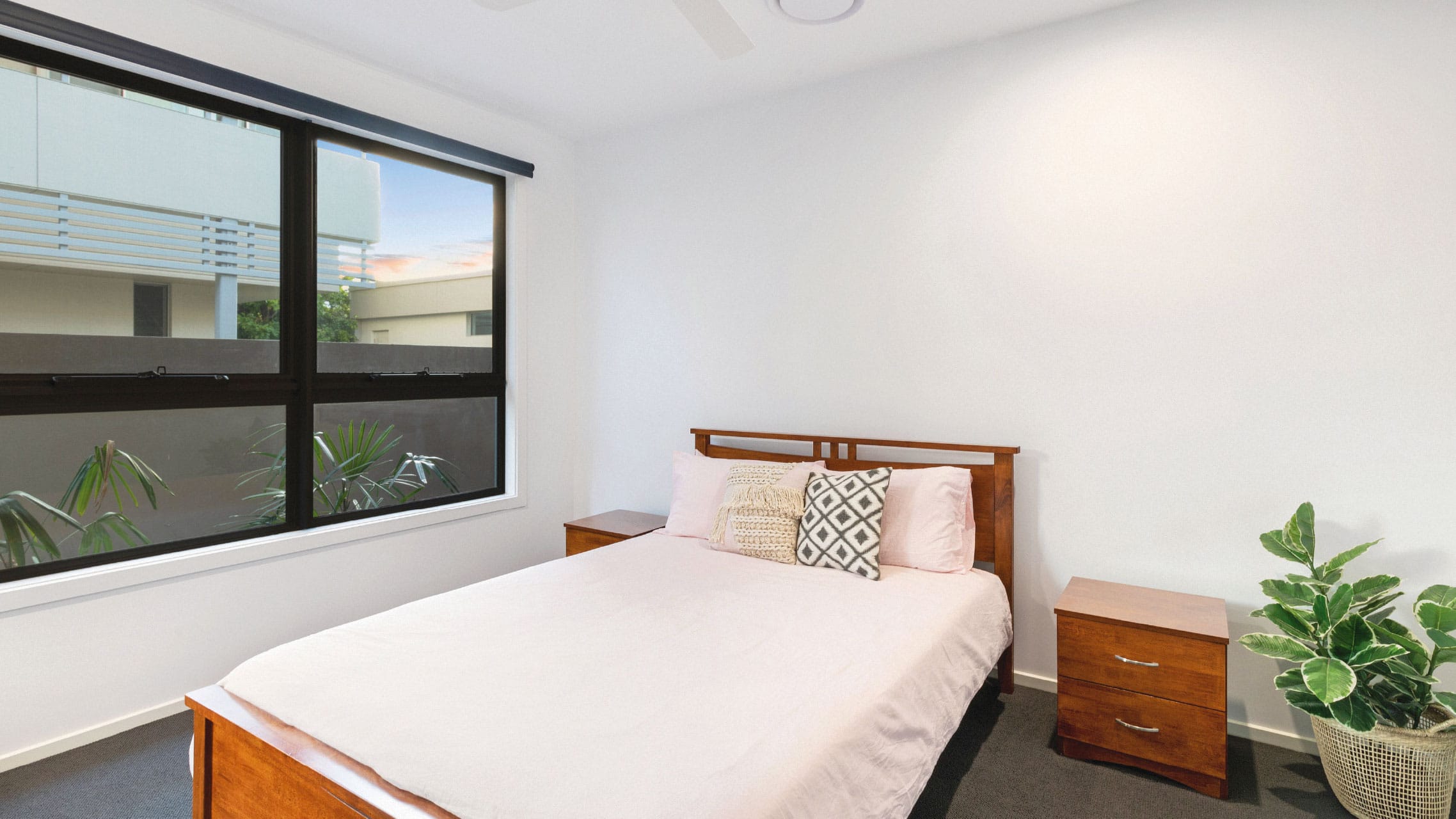 Aluminium awning windows with low lites in a bedroom