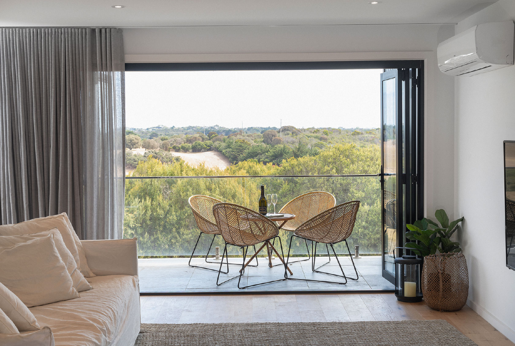 Black Bi fold Door opening out to a balcony