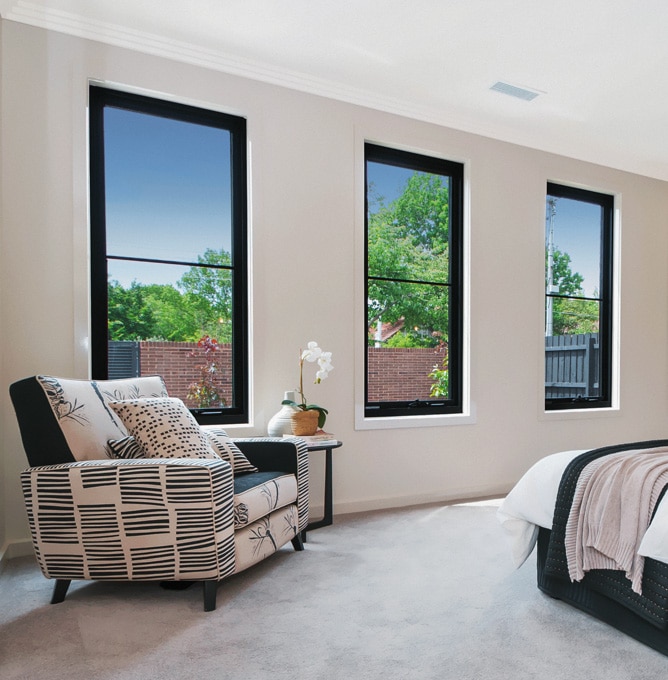 Four Black Awning Windows in a bedroom