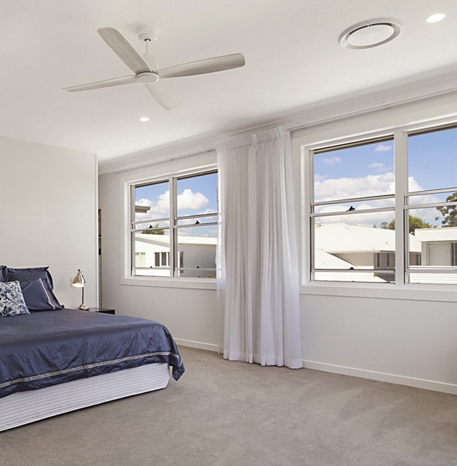 Two White Aluminium Double Hung Windows in the bedroom