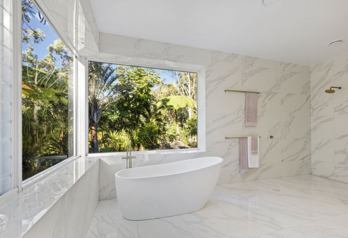 Two large fixed windows in a bathroom