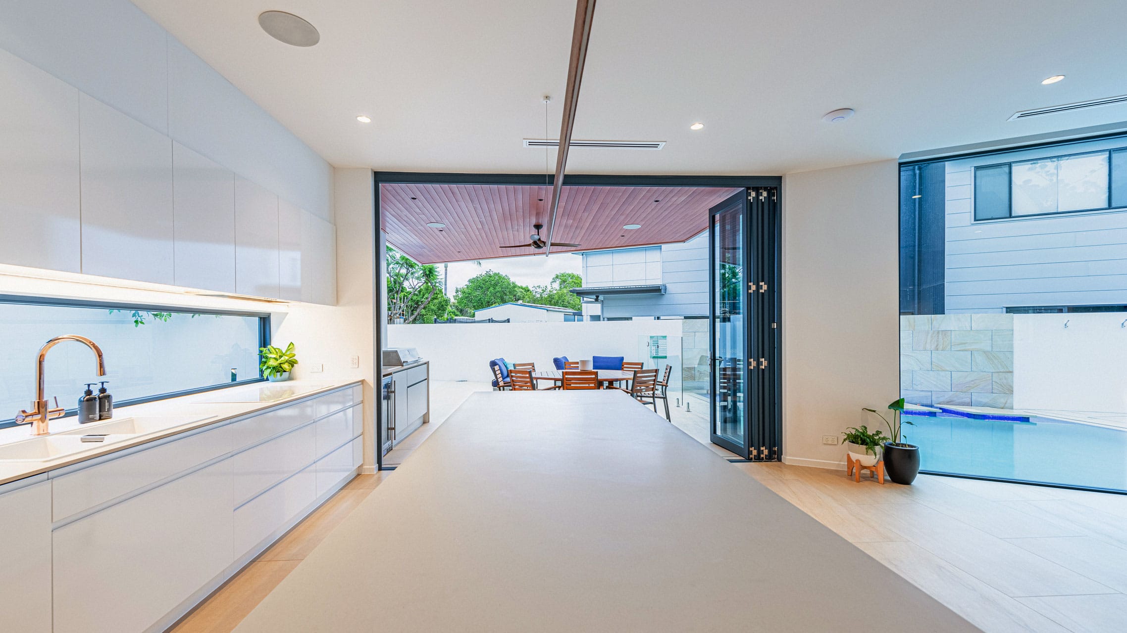 Blue Bi fold Door connecting inside and outside