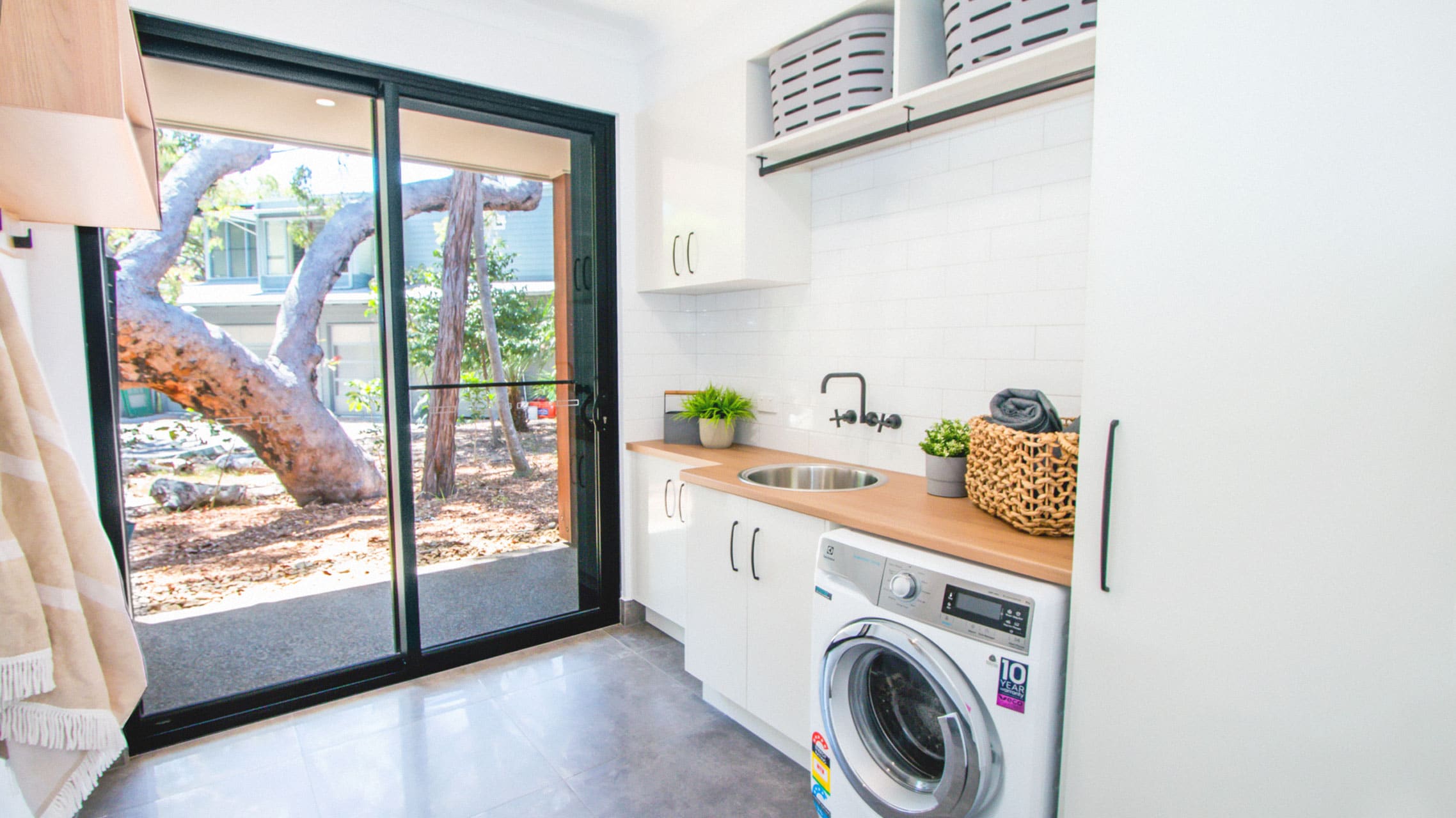 Black Aluminium Sliding Door in a laundry