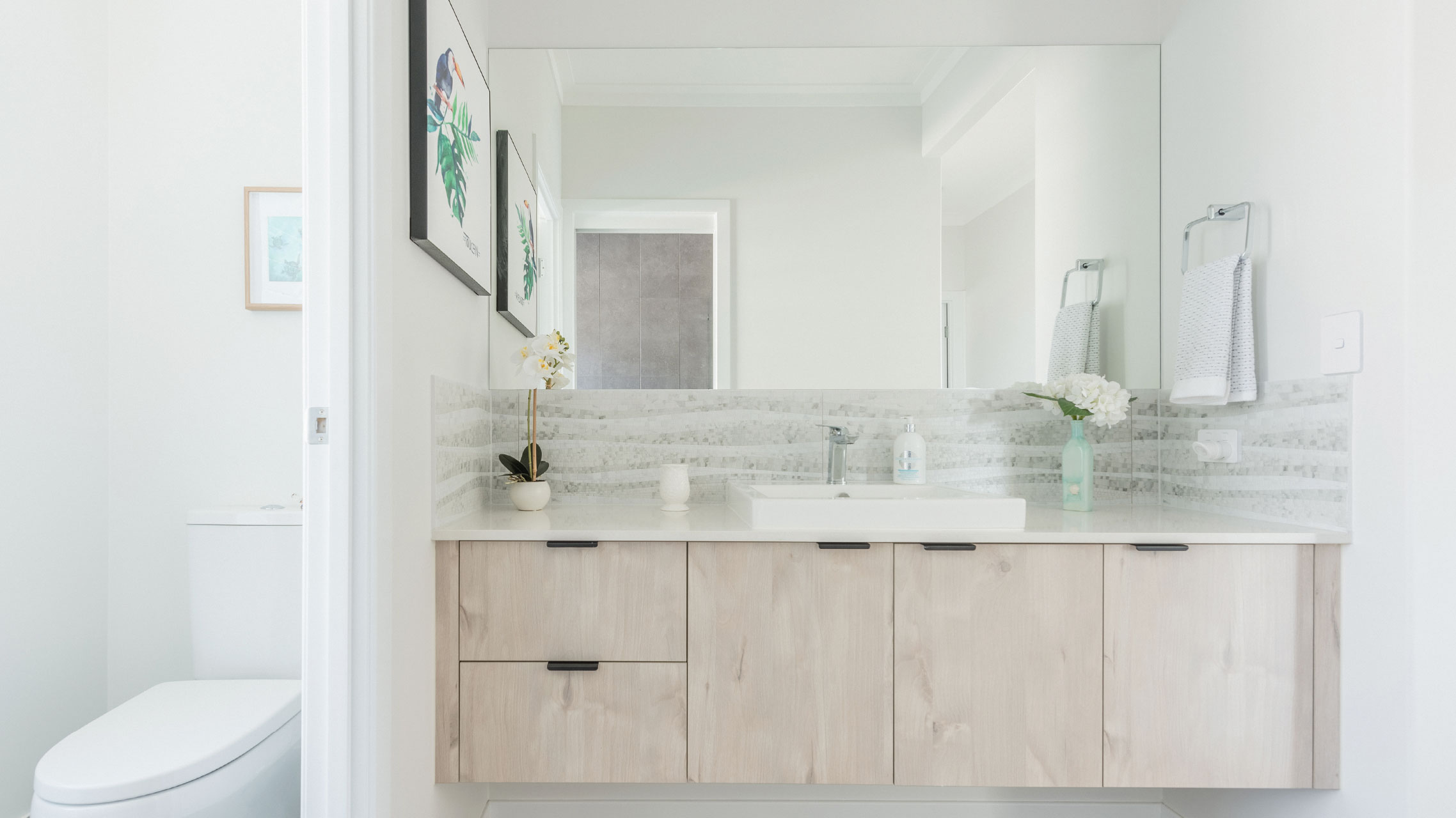 Frameless bathroom mirror in an ensuite