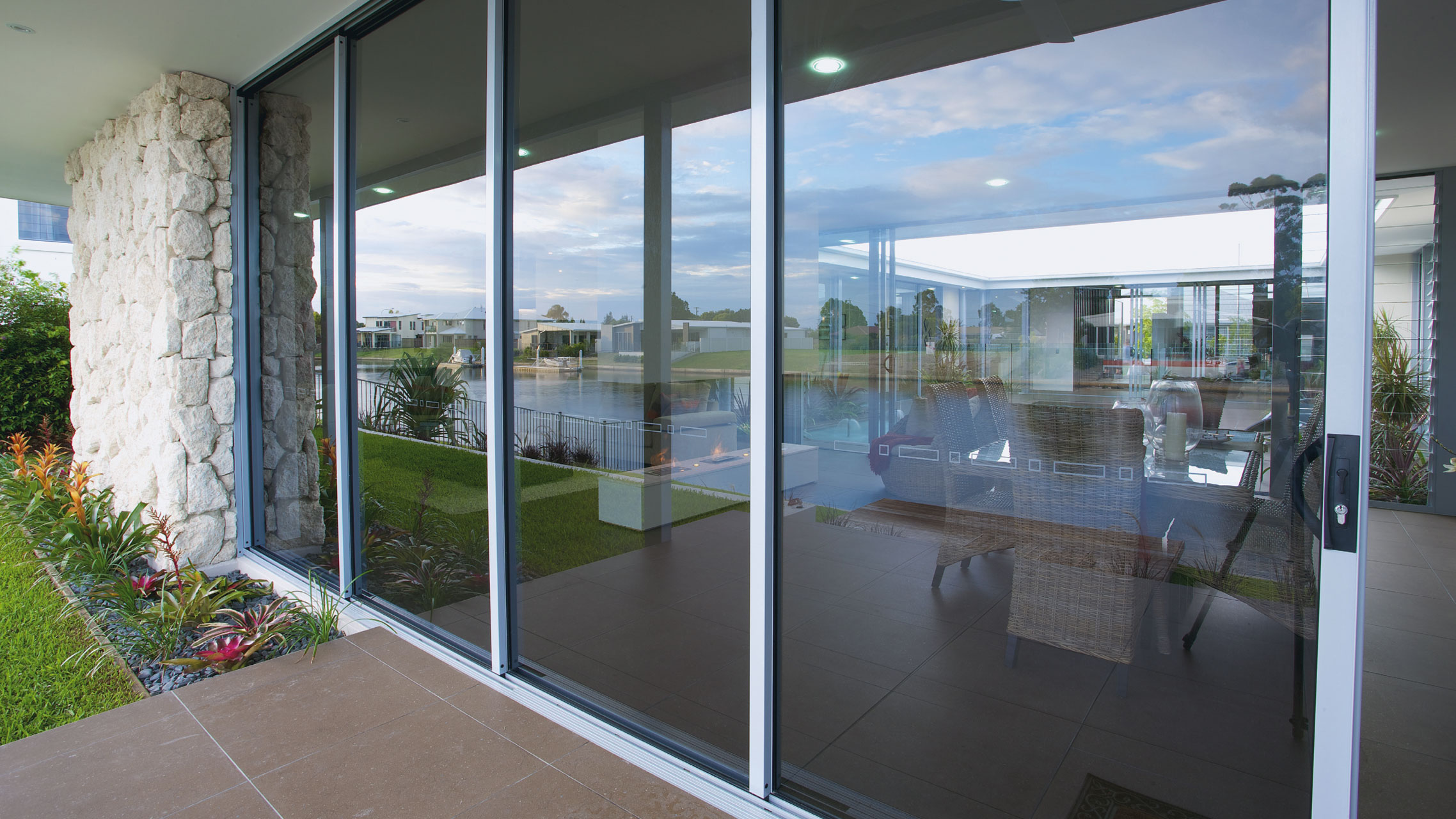 Ultra Silver Aluminium Cavity Sliding Door with grey glass