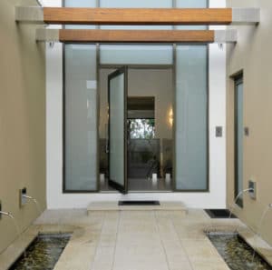 black aluminium pivot door with privacy glass