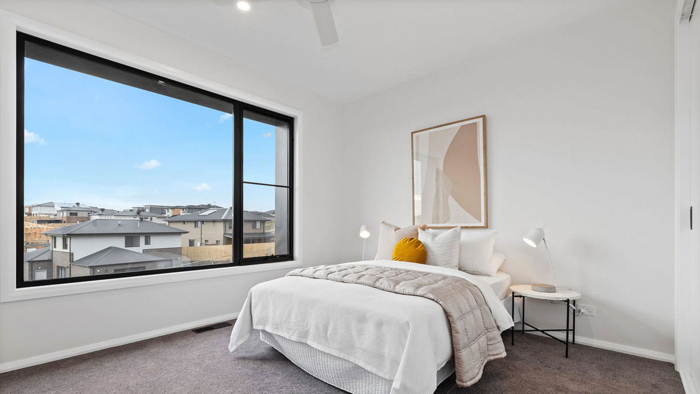 Bedroom with large fixed window