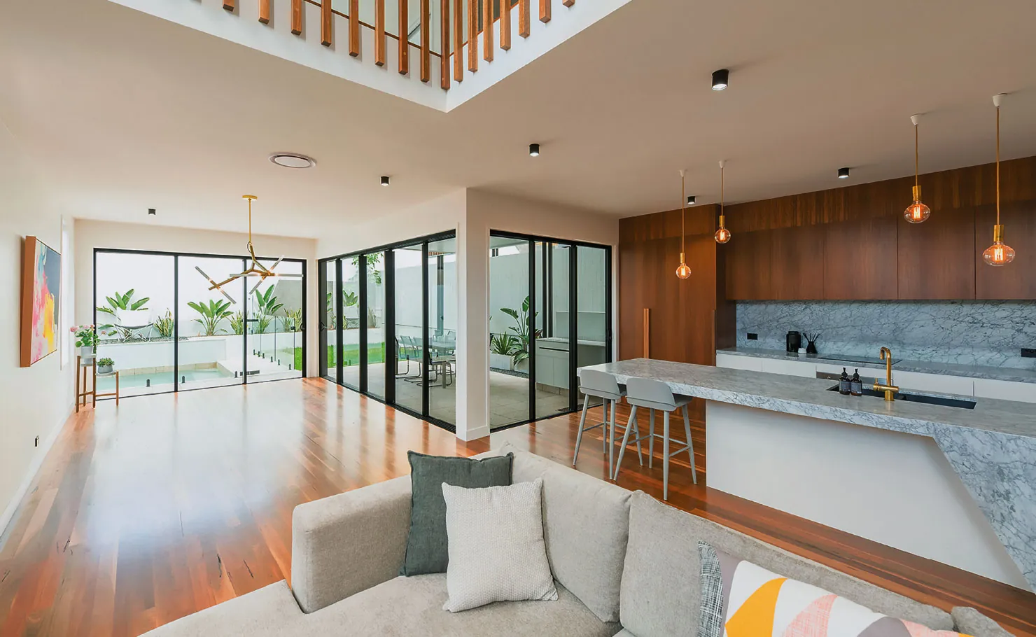 Three Aluminium Sliding Doors with black frames and clear glass